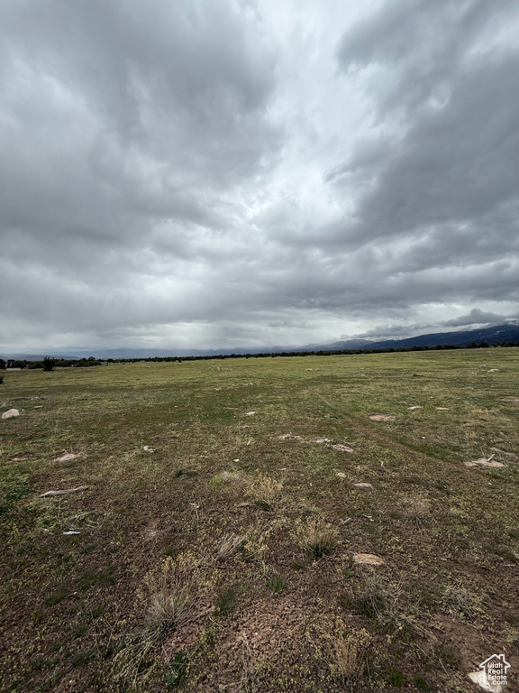 View of yard with a rural view