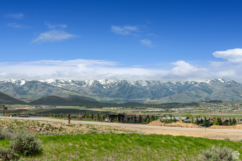 View of mountain backdrop with rural landscape
