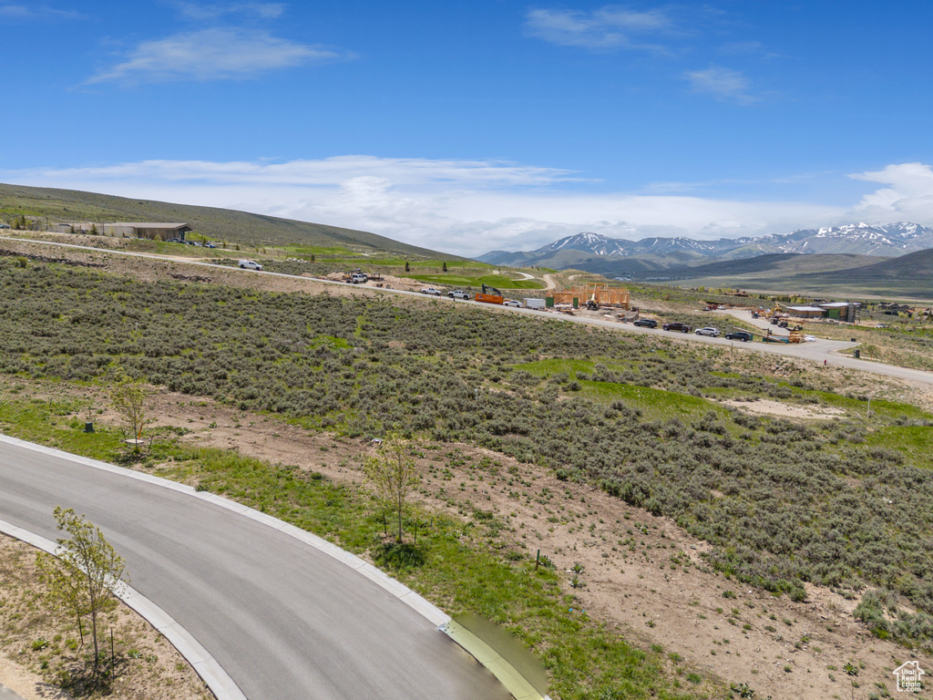 View of mountain background featuring rural landscape