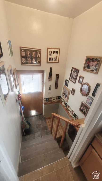 Staircase with tile patterned floors