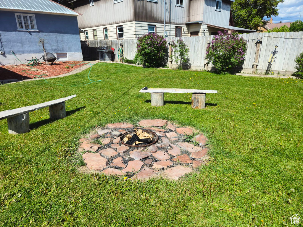 View of yard featuring a fire pit