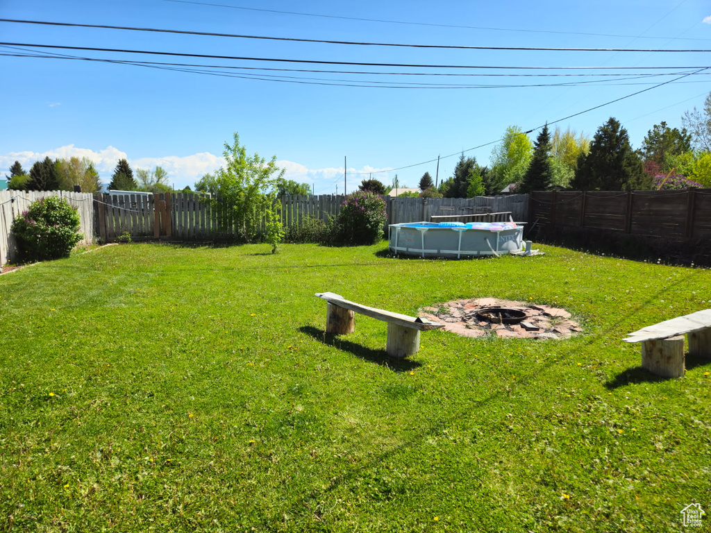 View of yard featuring a fire pit