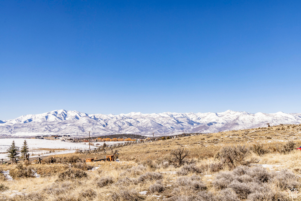 View of mountain backdrop with rural landscape