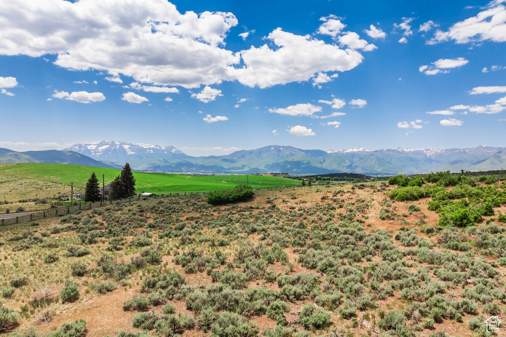 View of mountain background featuring rural landscape