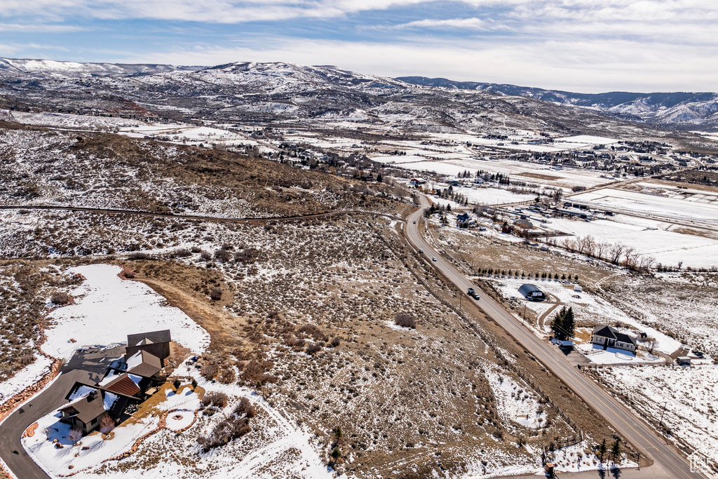 Snowy aerial view featuring a mountain view