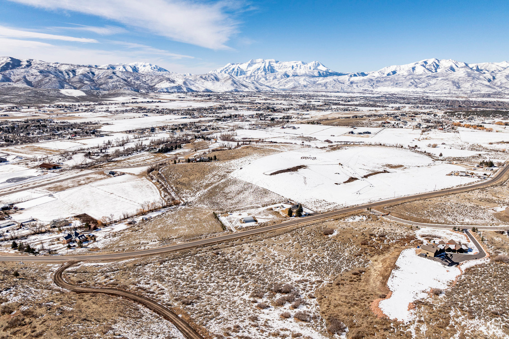 Snowy aerial view with a mountain view