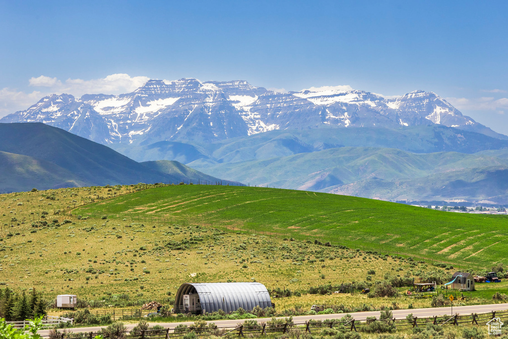View of mountain backdrop featuring rural landscape