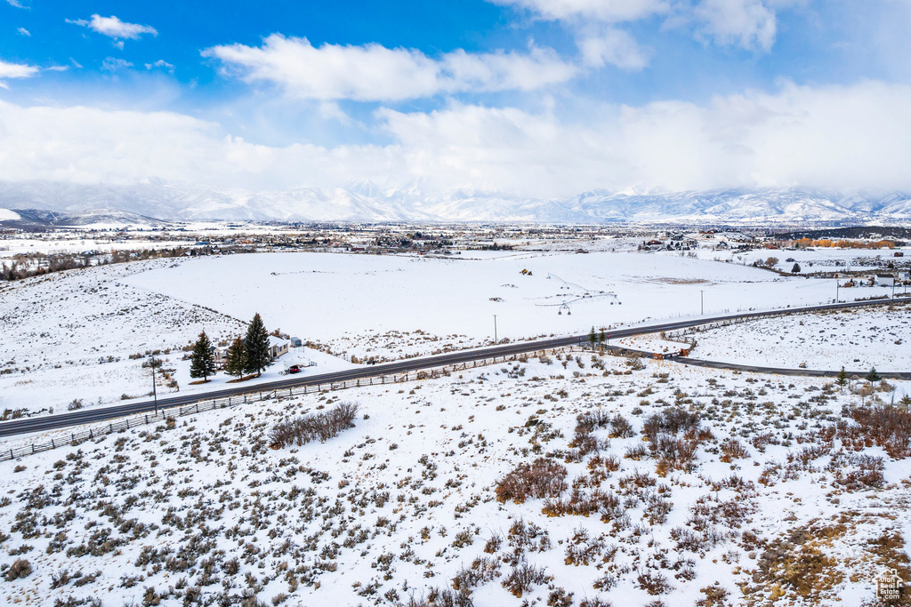 Snowy aerial view with a mountain view