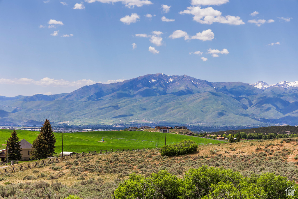 View of mountain backdrop featuring rural landscape