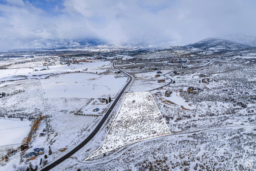 Snowy aerial view with a mountain view
