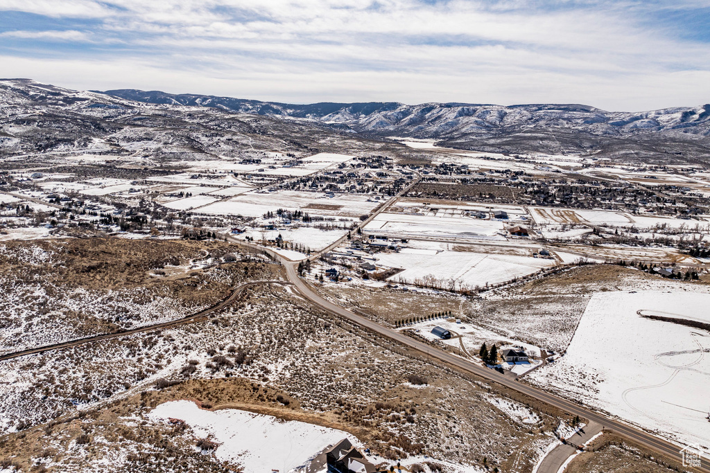 Snowy aerial view with a mountain view