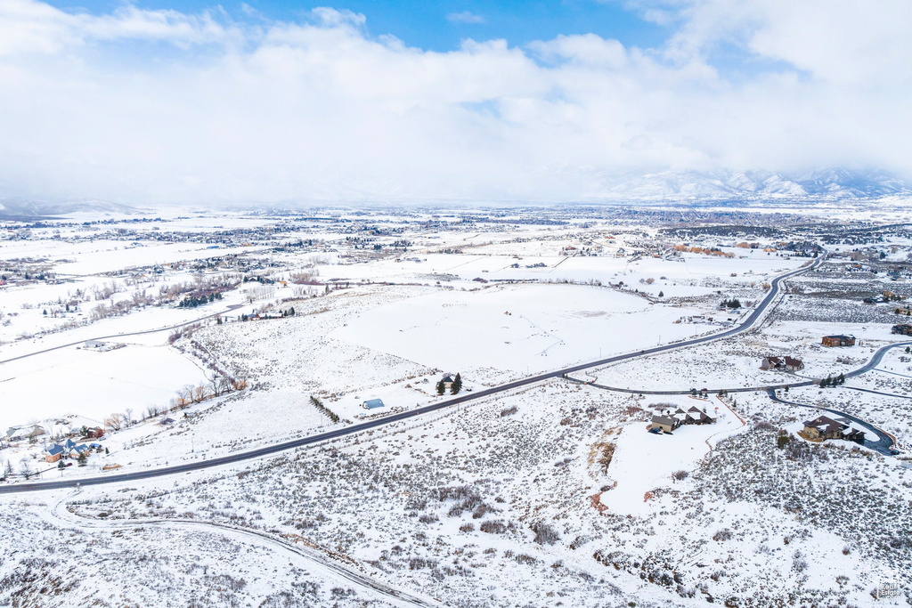Snowy aerial view with a mountain view