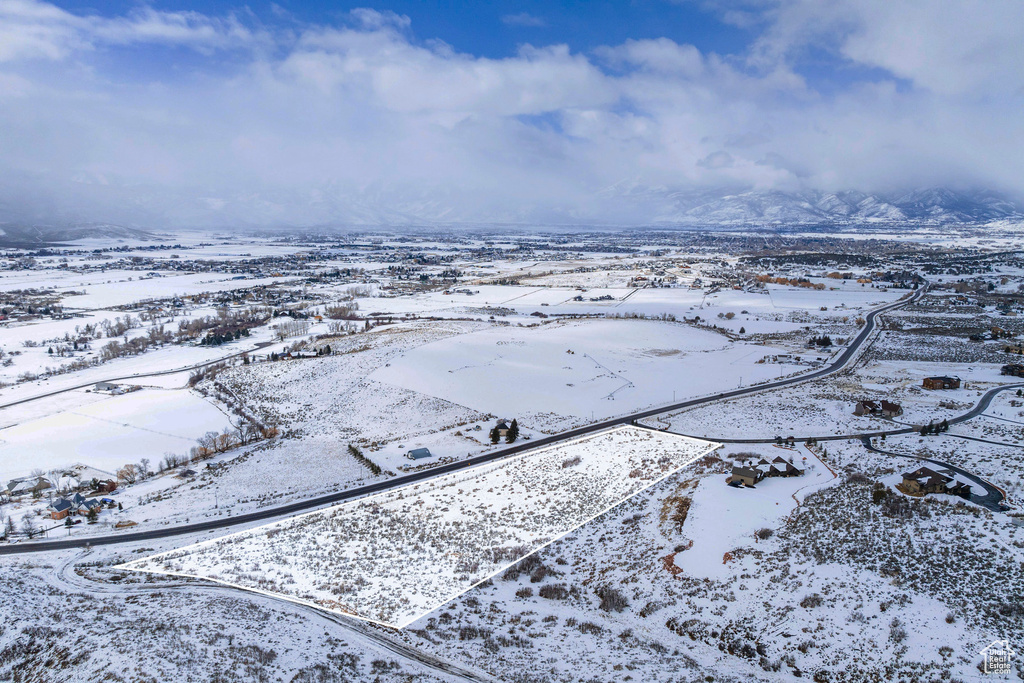 Snowy aerial view with a mountain view