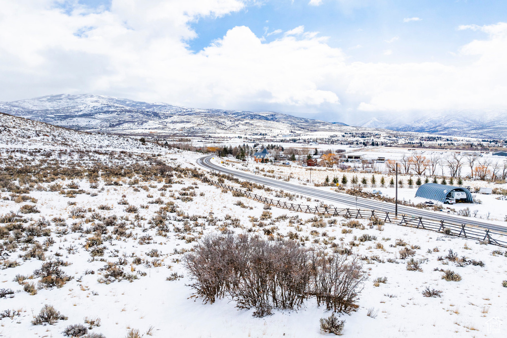 Snowy aerial view with a mountain view