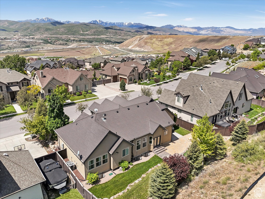 Aerial perspective of suburban area featuring a mountainous background