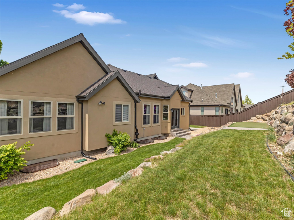 Rear view of house with stucco siding