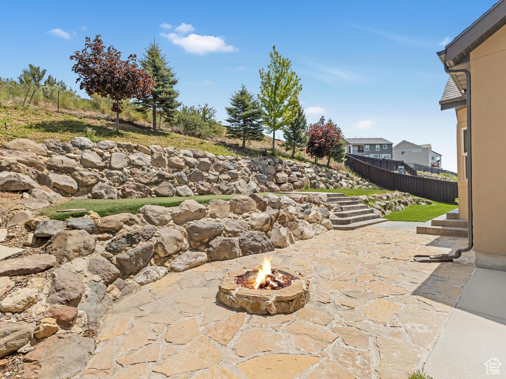 View of patio / terrace featuring an outdoor fire pit