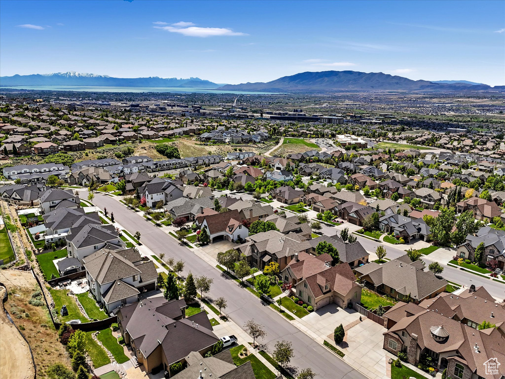 Aerial view of residential area featuring a mountainous background