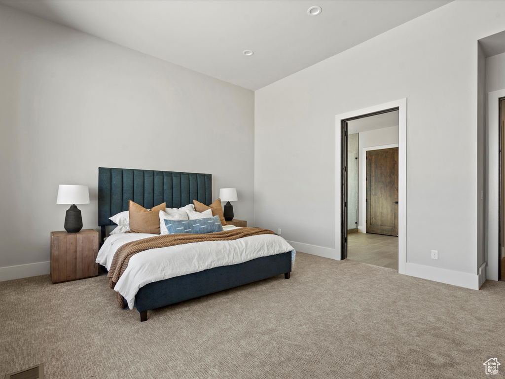 Carpeted bedroom featuring baseboards