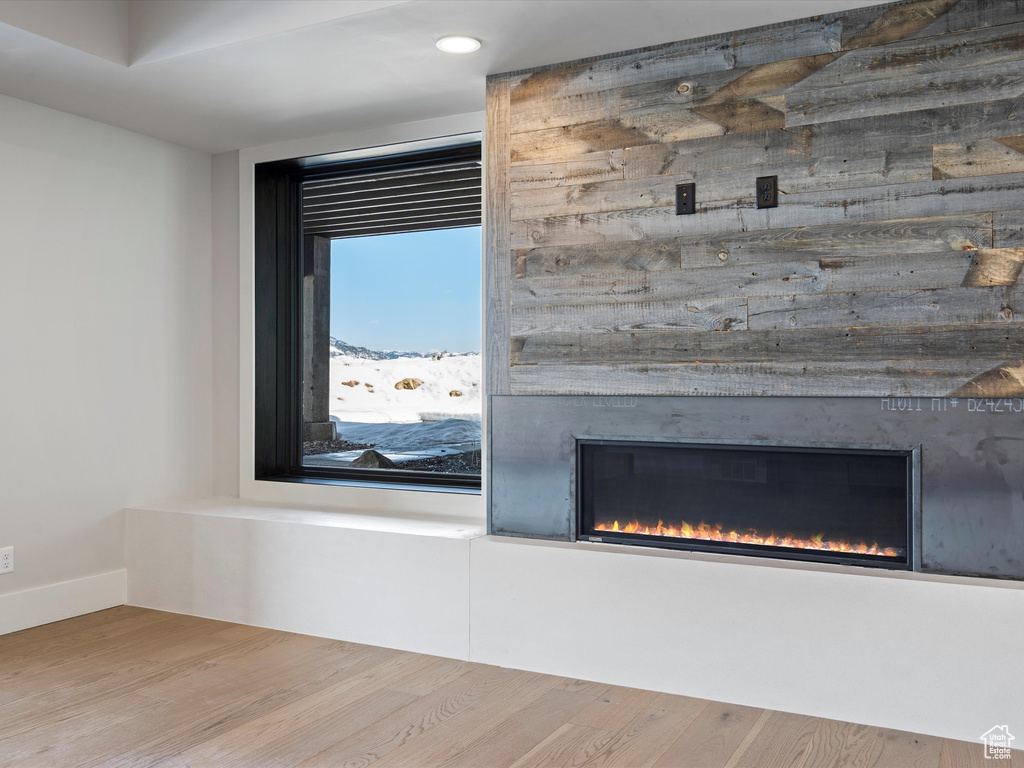 Room details with a fireplace and wood finished floors