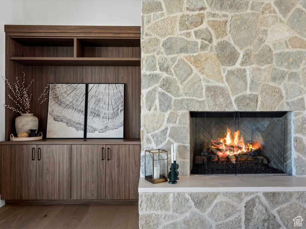 Room details with a fireplace and wood finished floors