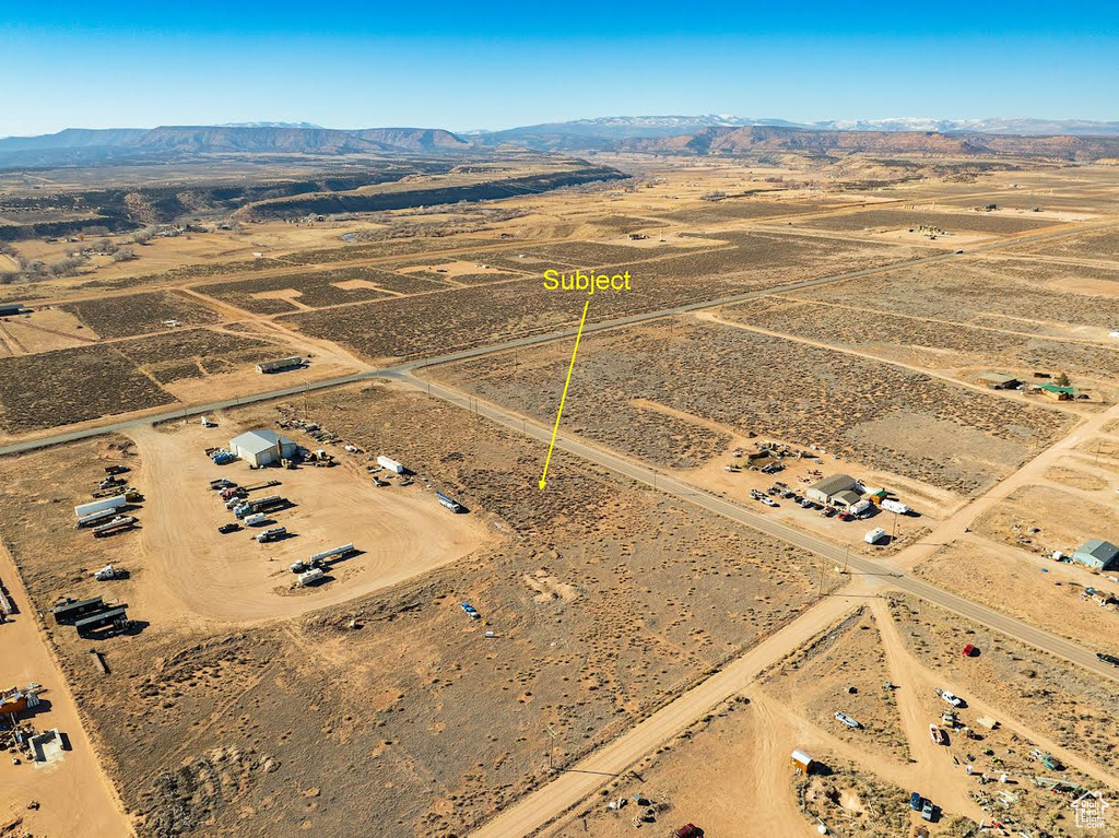 Birds eye view of property with a rural view and a mountain view