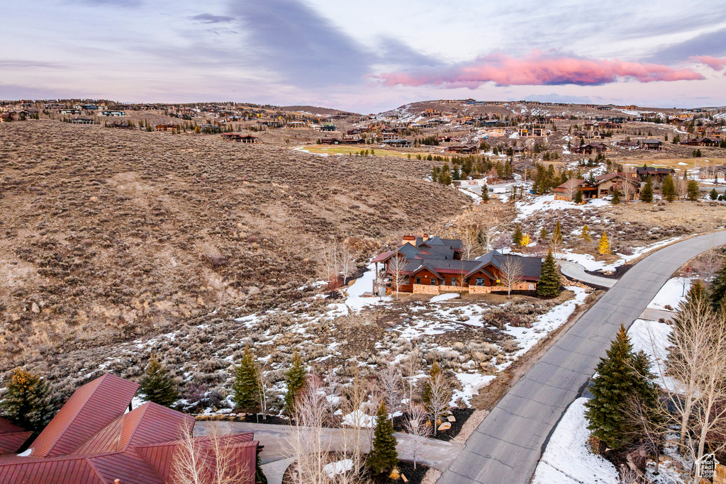 Aerial view of residential area featuring a mountain backdrop