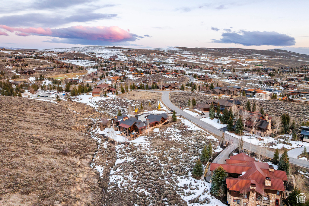 Snowy aerial view with a residential view and a mountain view