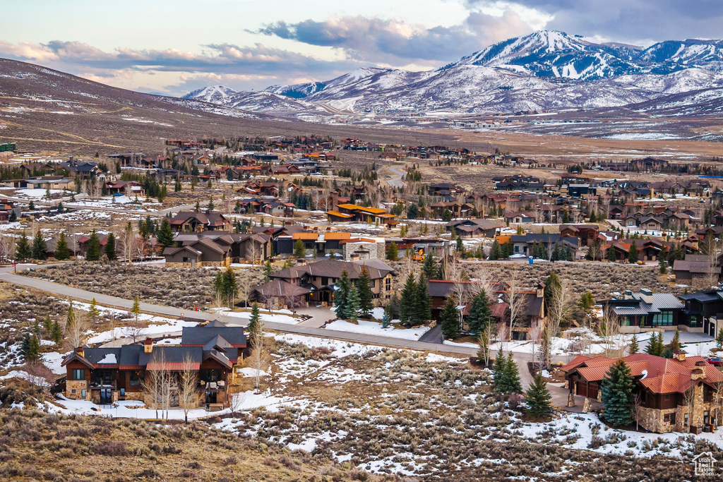 View of mountain backdrop featuring nearby suburban area