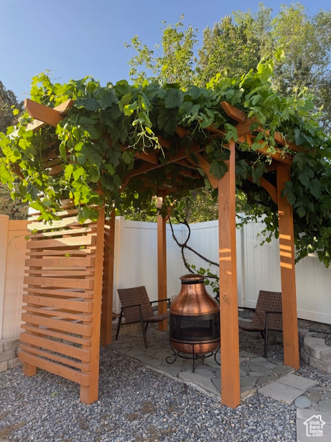 View of patio / terrace with a fire pit
