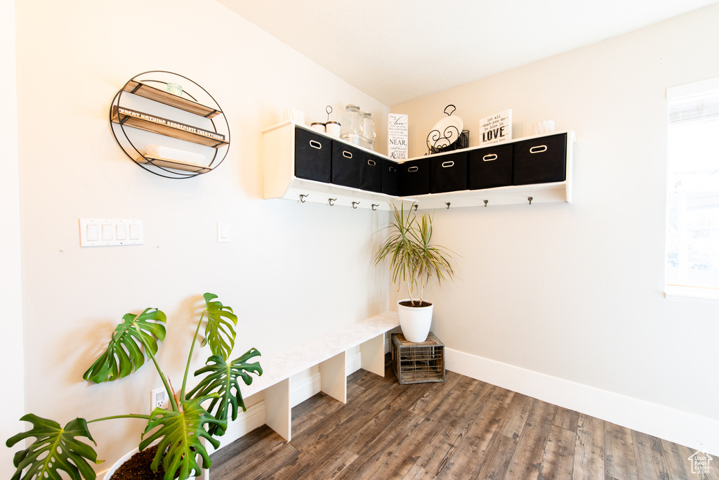 Mudroom with baseboards and wood finished floors