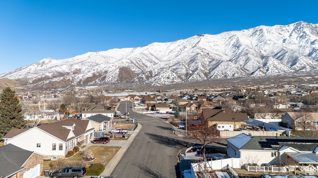 Property view of mountains with a residential view