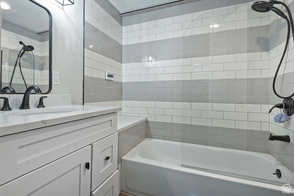 Full bath with  shower combination and vanity
