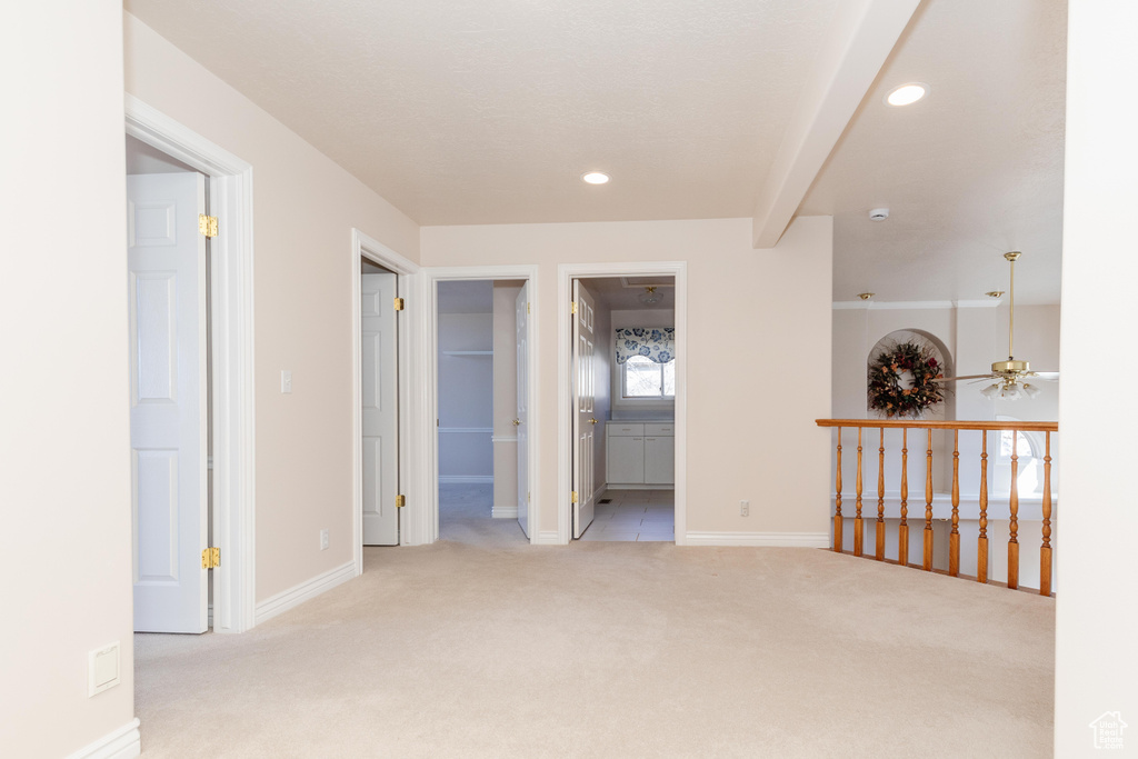 Spare room with baseboards, carpet flooring, a ceiling fan, and recessed lighting