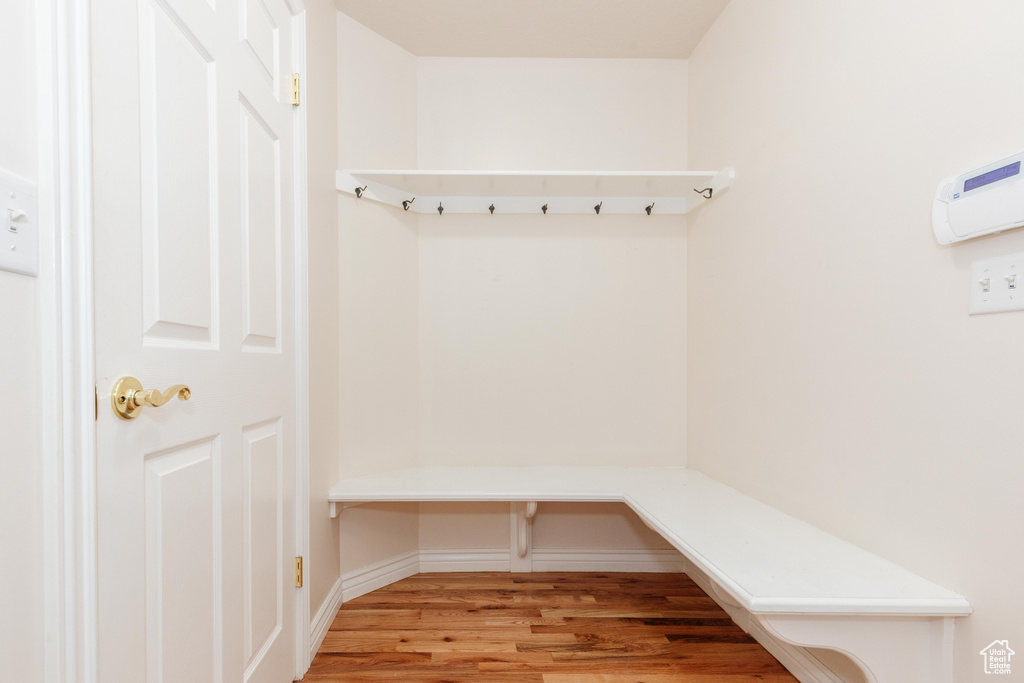 Mudroom with baseboards and wood finished floors