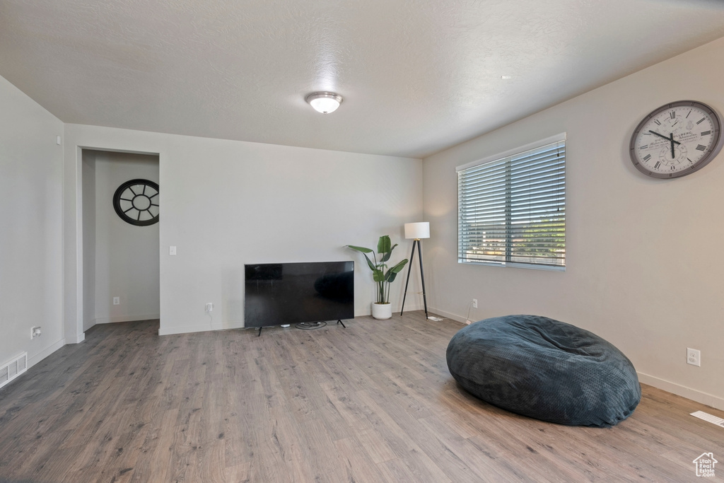Living area with wood finished floors