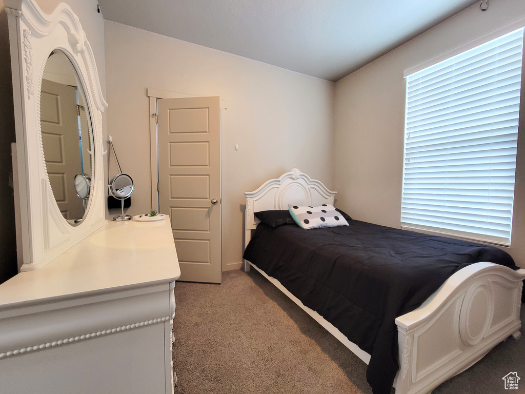 Bedroom with light colored carpet