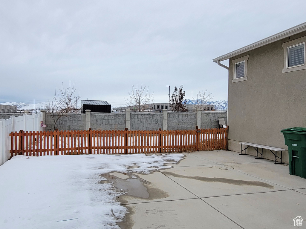 Wooden terrace featuring a patio and fence