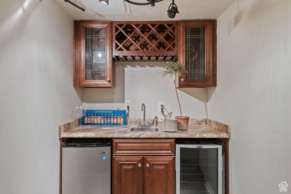 Indoor wet bar with refrigerator and beverage cooler