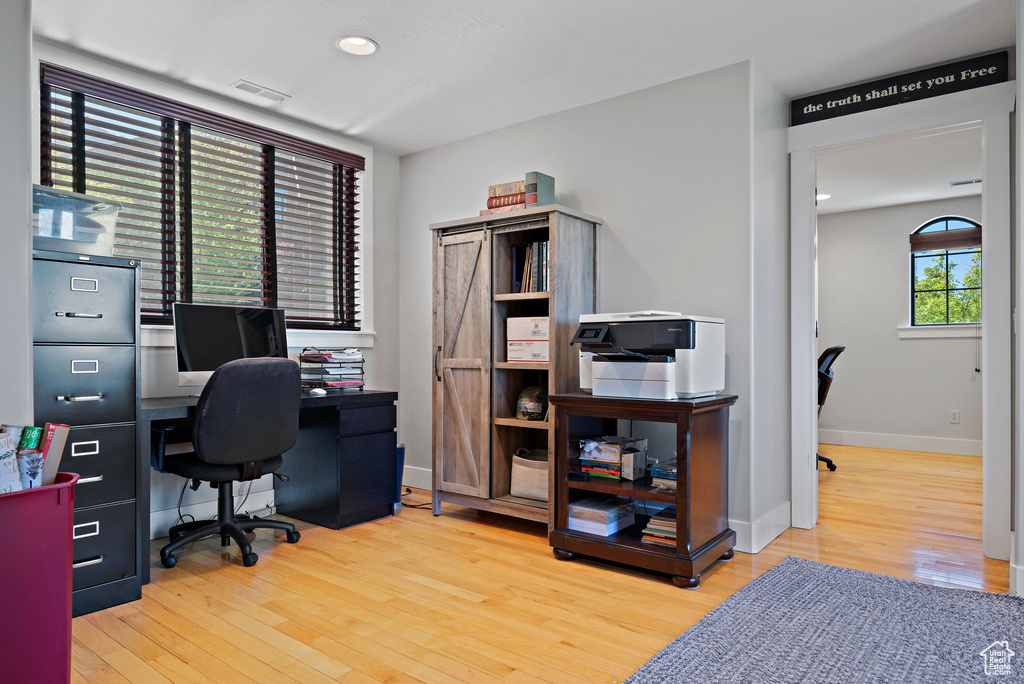 Office area with recessed lighting, baseboards, visible vents, and wood finished floors