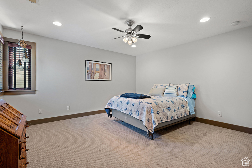 Bedroom with recessed lighting, baseboards, and carpet