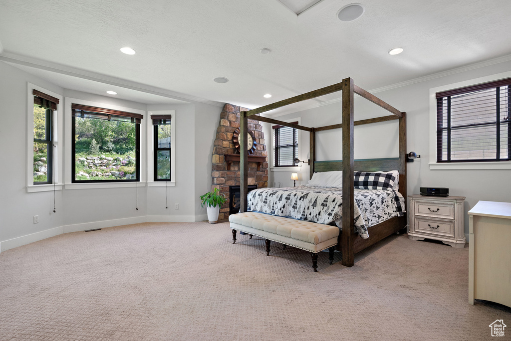 Bedroom featuring baseboards, recessed lighting, and light colored carpet