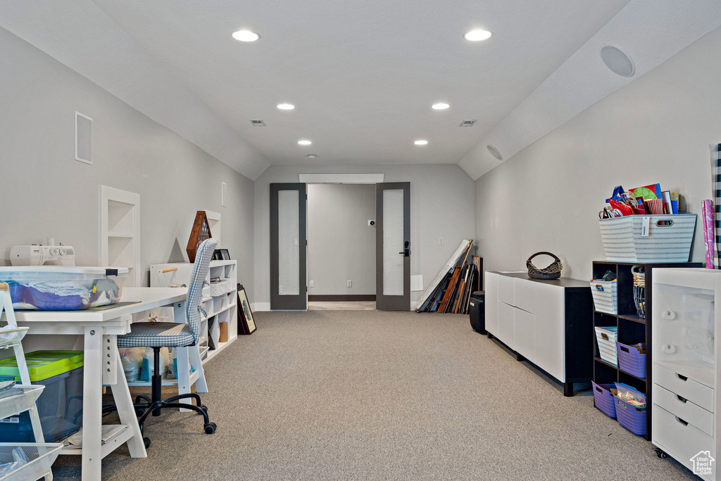 Office with light carpet, vaulted ceiling, recessed lighting, and visible vents