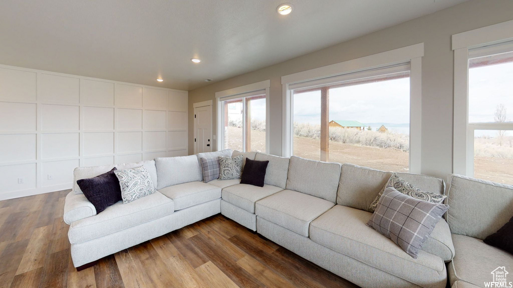 Living room with wood finished floors and recessed lighting