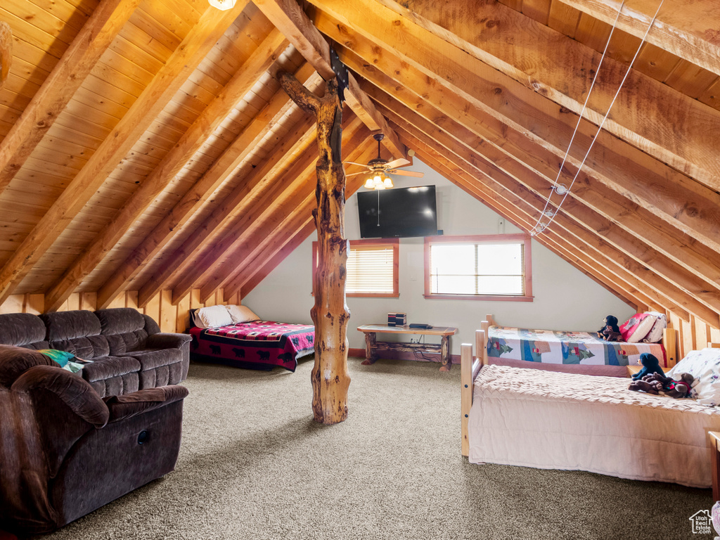 Carpeted bedroom with vaulted ceiling and wooden ceiling