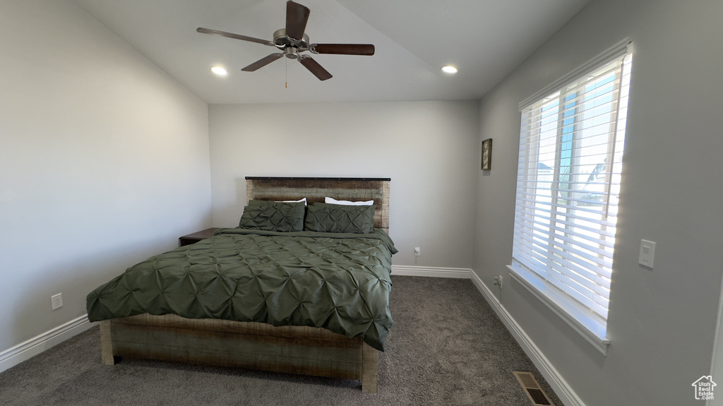 Carpeted bedroom featuring multiple windows, recessed lighting, and baseboards