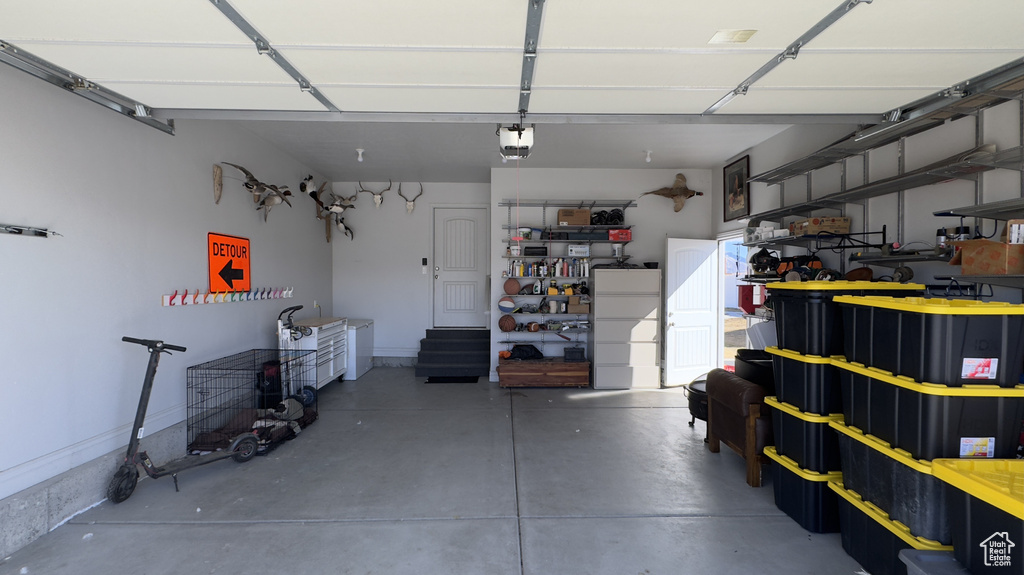 Garage featuring a garage door opener