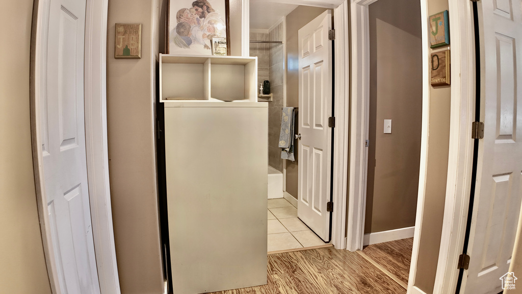 Hallway featuring baseboards and light wood-type flooring