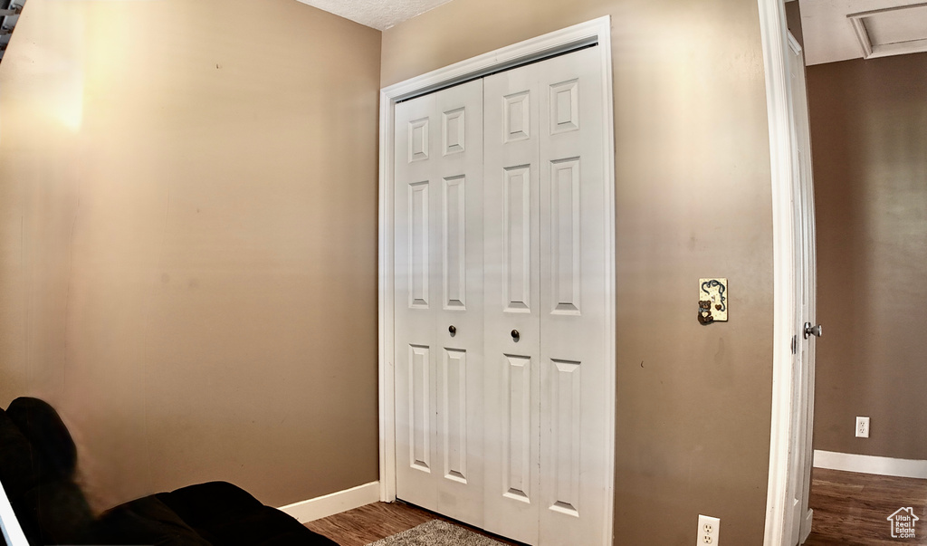 Entryway featuring wood finished floors and baseboards