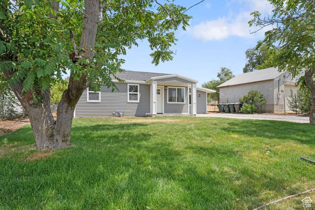 View of front of property with a front yard